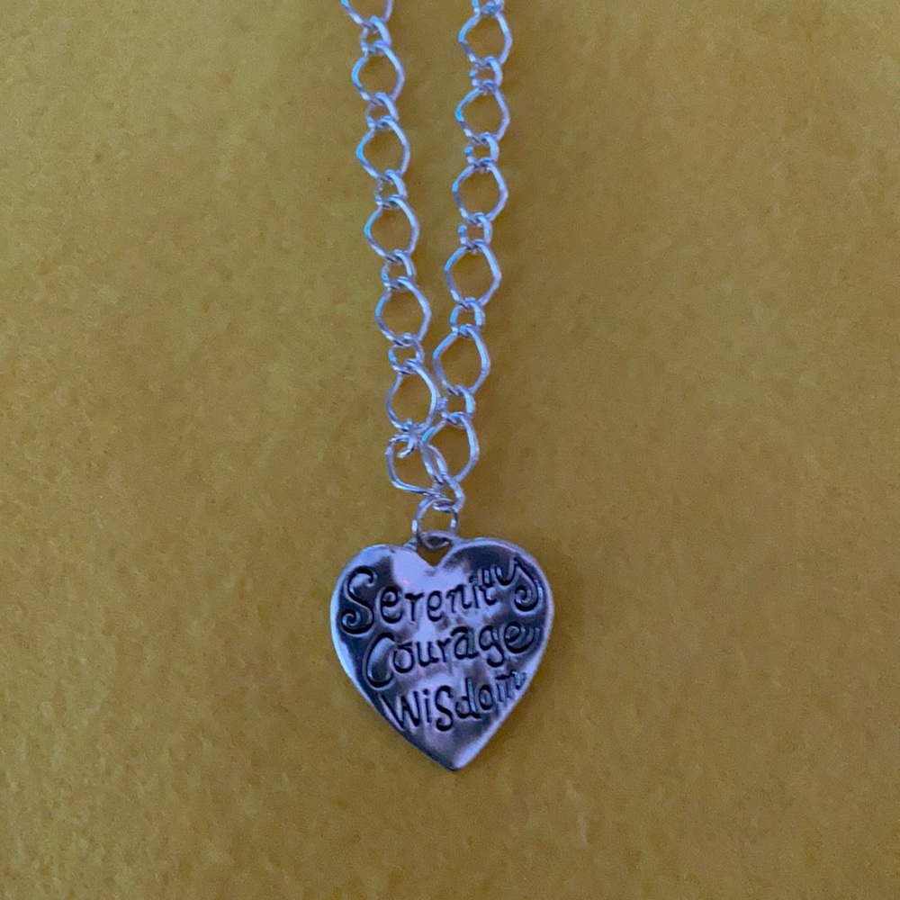 Beautiful silver necklace with charm.